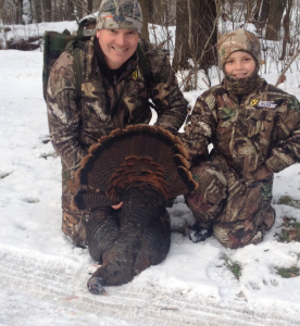 Douglas with his son Campbell hunting wild turkey in 2014