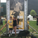 Heather (49) & Carter (11) in front of her poster at the 2018 Pitts Marathon  5.5.2018